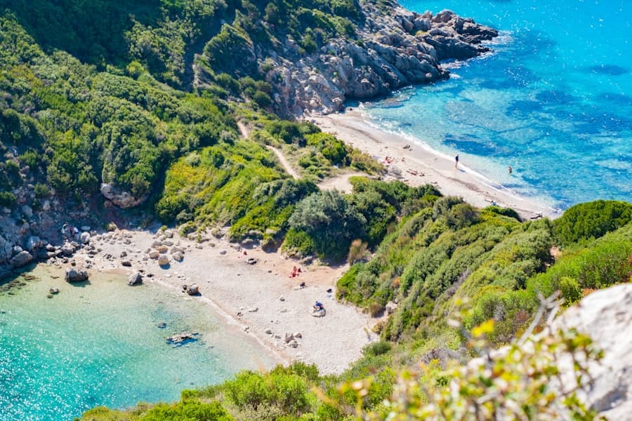 an aerial view of a sandy beach with blue water, Corfu — CautaVacanta.ro